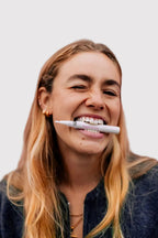 Smiling woman with the SuperSmile Advanced Teeth Whitening Pen