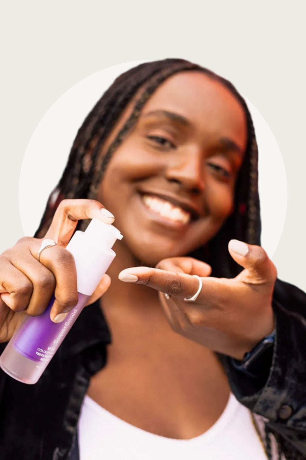 Smiling woman with SuperSmile V34 Colour Correction Serum