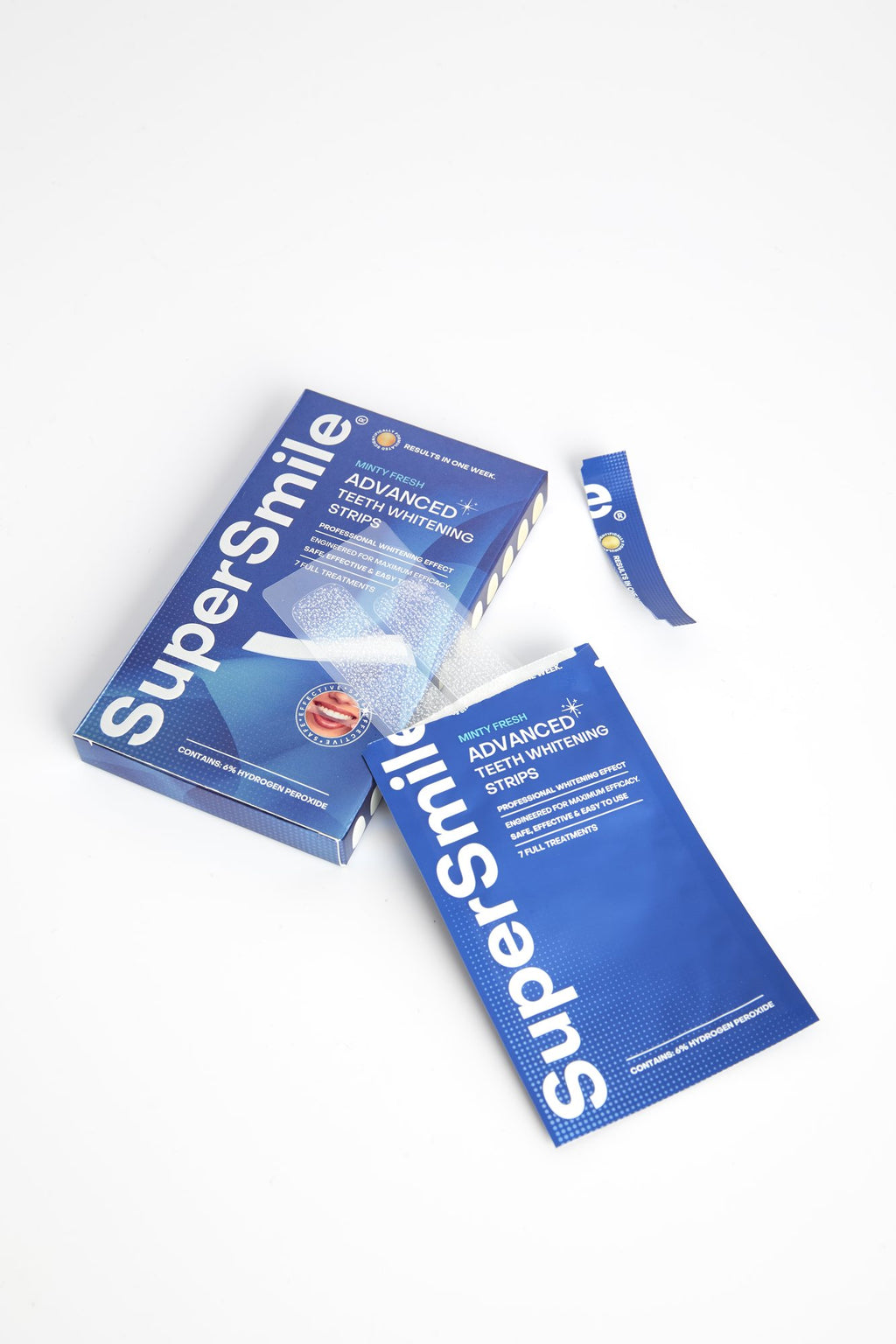 Open box of SuperSmile Advanced Whitening Strips with sachets